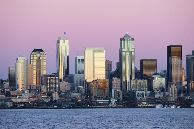 Photo waterfront skyscrapers at dusk