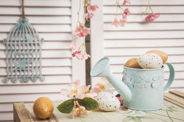 Watering can with  easter eggs