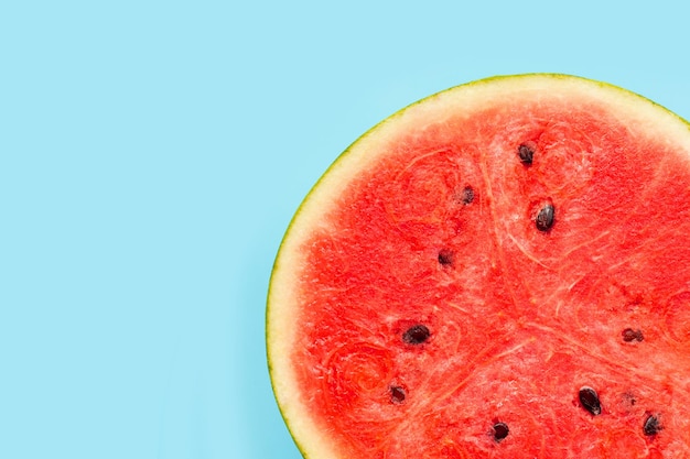 Watermelon on blue background copy space