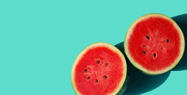Watermelon on blue background with copy space. Summer background concept.