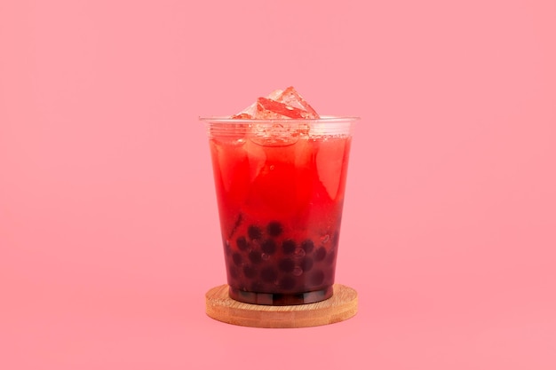 Watermelon boba drink or fruits bubble tea in disposable plastic take away cup  Summer iced drink