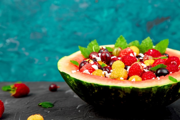 Watermelon bowl with cottage cheese and berries