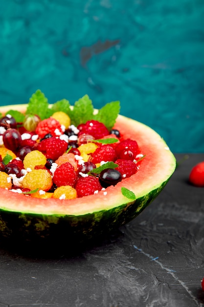 Watermelon bowl with cottage cheese and berries