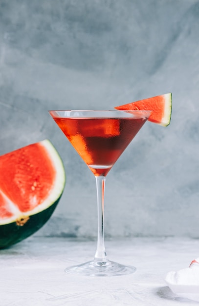 Watermelon cocktail in martini glass on the table. Refreshing drink