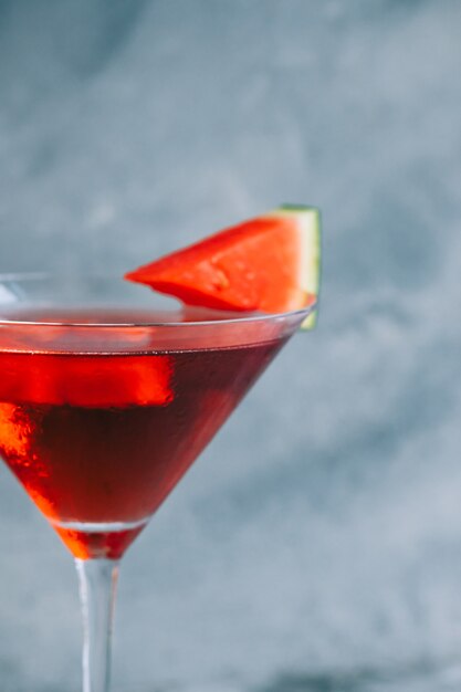 Watermelon cocktail in martini glass on the table. Refreshing drink