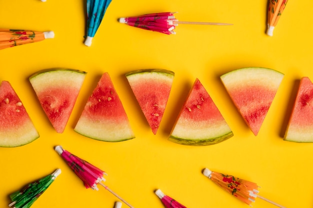 Watermelon and cocktail umbrella tropical summer background