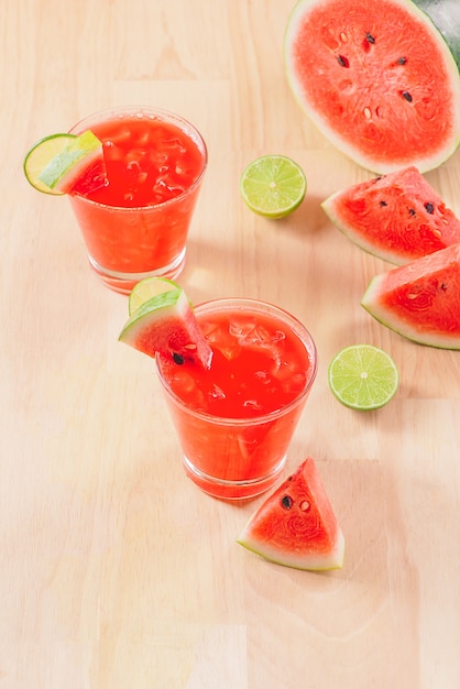 Watermelon drink in glasses with slices of watermelon in summertime