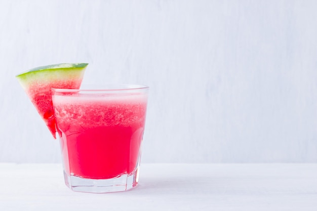 Watermelon drink in glasses with slices of watermelon Watermelon smoothies on white background