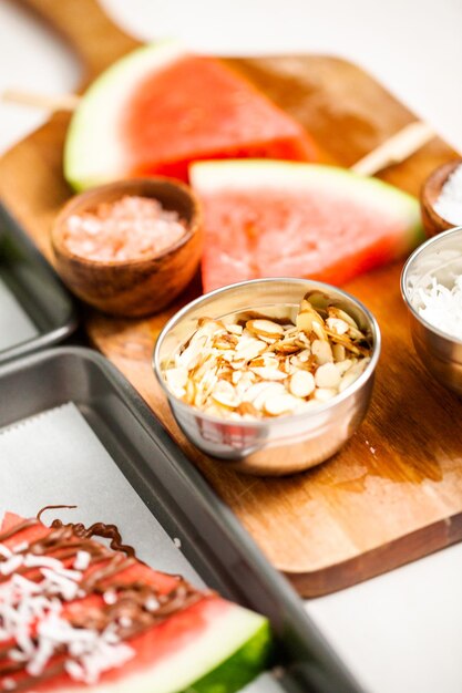 Watermelon drizzled with chocolate and topped with flaked sea salt and almonds.