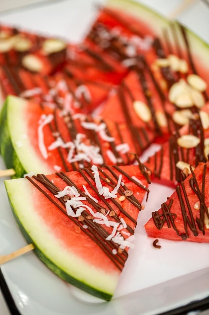 Watermelon drizzled with chocolate and topped with flaked sea salt and almonds.