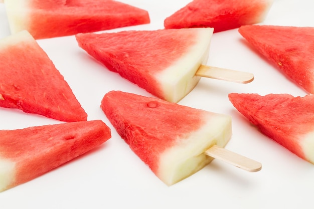 Watermelon in ice lollies shape on a white background