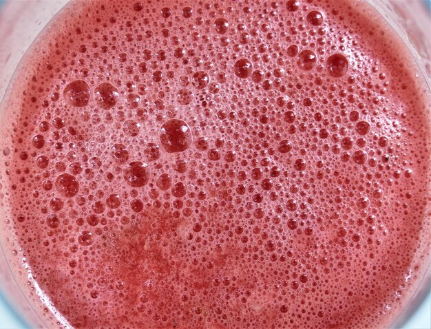 Watermelon juice cocktail with bubbles summer background