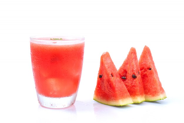 Watermelon juice with slice piece on wood tray and isolated on white wall