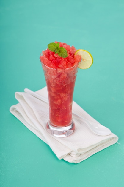 Watermelon mint juice cutpiece of watermelon arranged in a\
white transparent glass