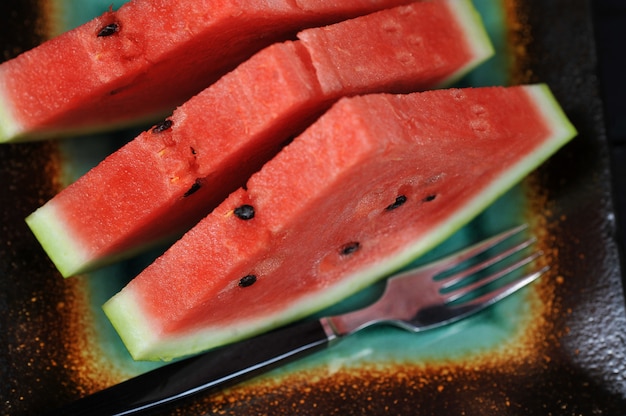 Watermelon pieces in a black bowl