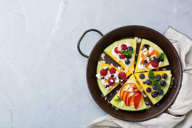 Watermelon pizza with berries fruit yogurt feta cheese