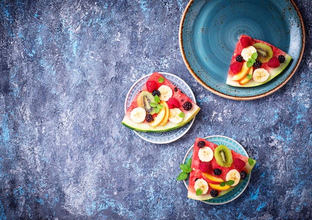 Watermelon pizza with fruit and berries