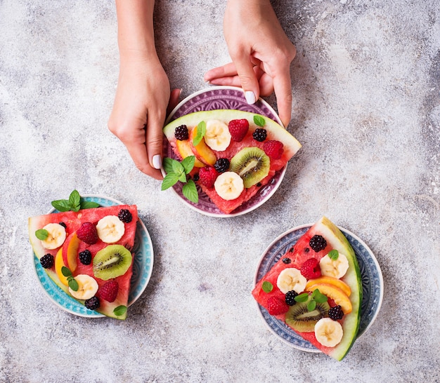 Watermelon pizza with fruit and berries