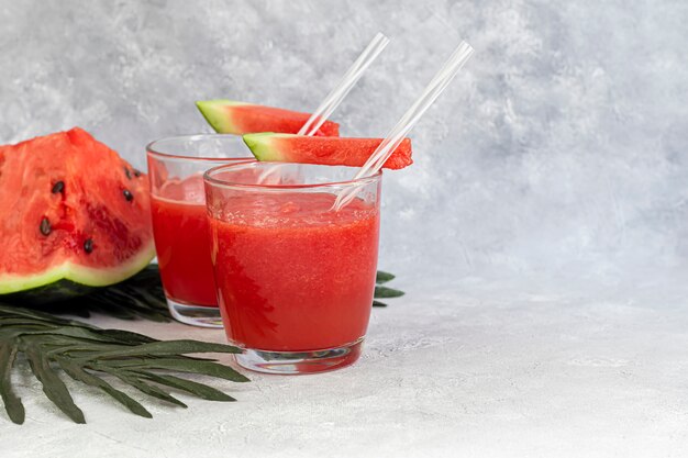 Watermelon pulp smoothie. Delicious red sliced watermelon on a plate. Stock of fiber and fructose. Summer food concept.