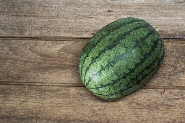 Watermelon put on grunge wood table