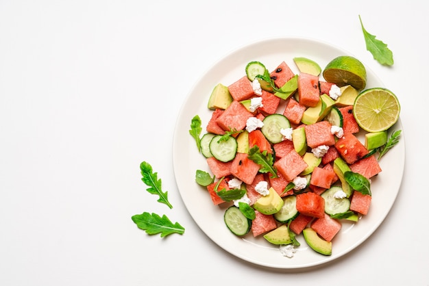 Watermelon salad with avocado cucumber feta cheese and arugula