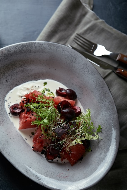 Watermelon salad with mozzarella, beautiful table setting