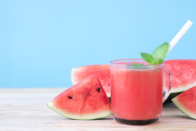 watermelon slice drink juice on wood table