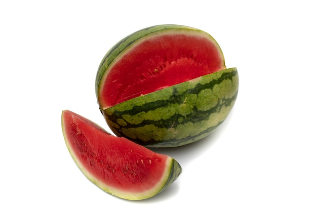 A watermelon and a slice, isolated on white background. It is originally from Africa .