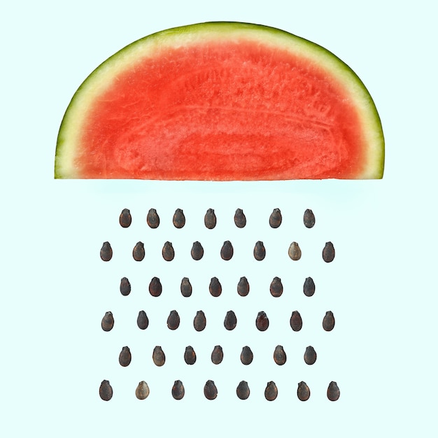 Watermelon slice with seeds raining