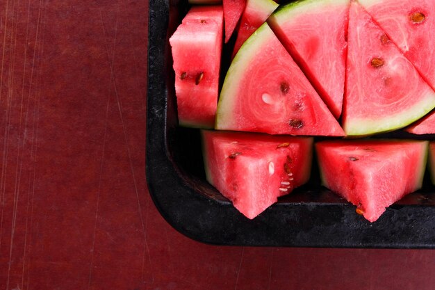Watermelon slices Pieces of ripe watermelon in old metal dishes Red watermelon with fructose for diet Cleansing the body with diuretic meal