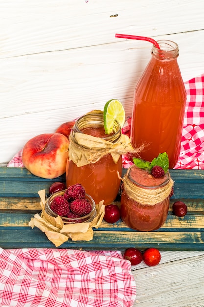 watermelon smoothie in a jar with peach, lime