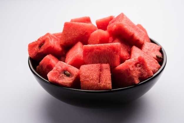 Watermelon or tarbooj fruit cube slices served in a bowl. selective focus