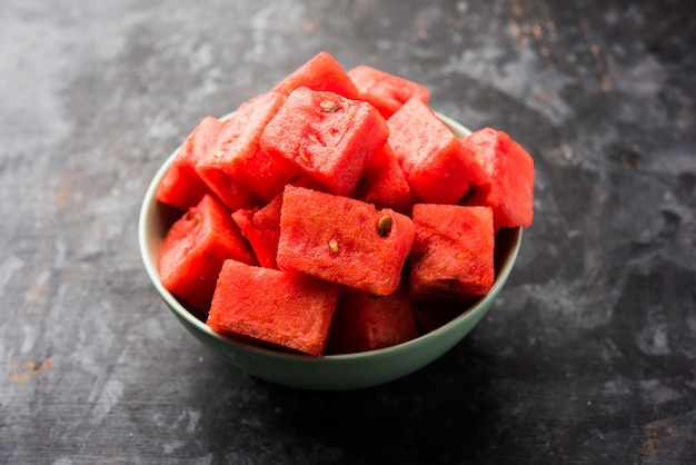 Watermelon or tarbooj fruit cube slices served in a bowl. selective focus