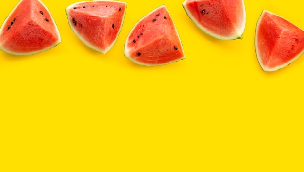 Watermelon on yellow background. Copy space
