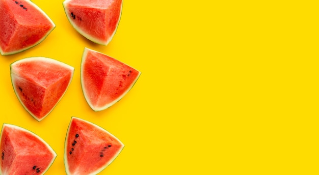 Watermelon on yellow background. top view