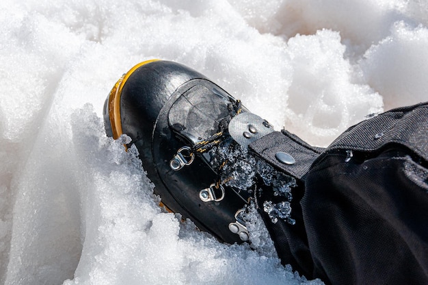 Waterproof boots for hiking, shoes in the water. Detail of men's climbing boots