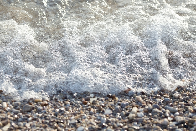 Wave motion and blurred pebbles.