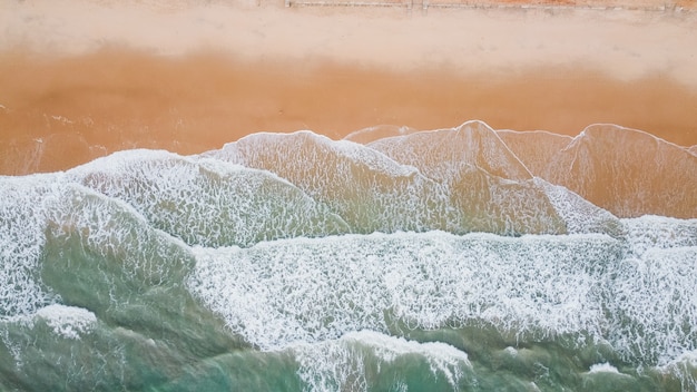 Wave of the sea on the sand beach