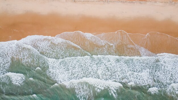 Wave of the sea on the sand beach