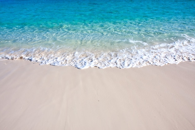 Wave of the sea on the sand beach