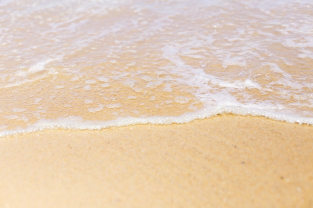 Wave of the sea on the sand beach