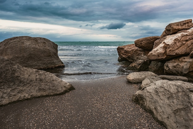 Wave splashing at the rocks freshness on beach