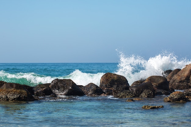 Waves are broken against stones