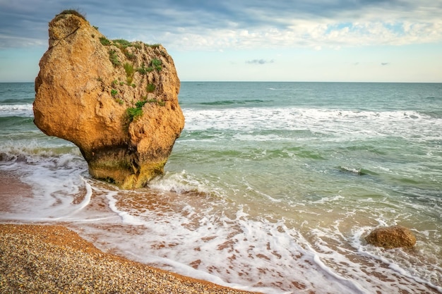 Waves beat against the coastal sea rock rocks beach and\
beautiful turquoise sea water exotic beach beautiful landscape\
composition of nature general\'s beaches crimea