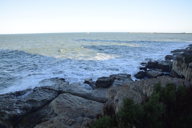 The waves break on the rocks on the shore Mar del Plata Buenos Aires Argentina