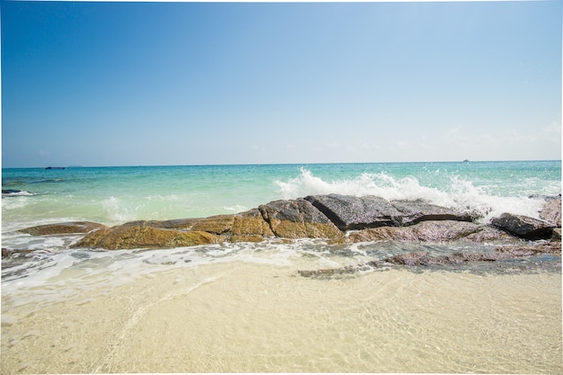 Waves breaking on the rock on the Caribbean beach