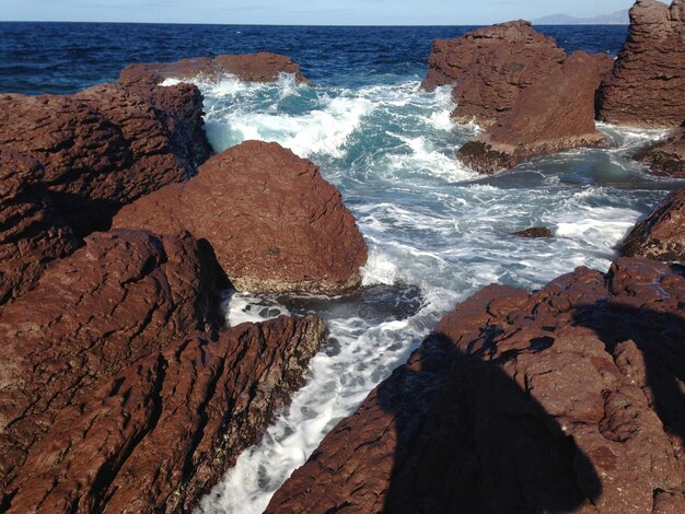 Waves breaking on rocks