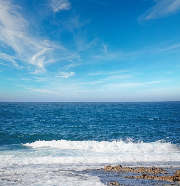 Waves and clouds in Argentiera coastline