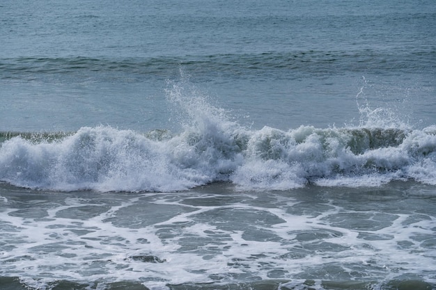 Waves crashing on the beachrolling waves crashing phuket beach\
thailand