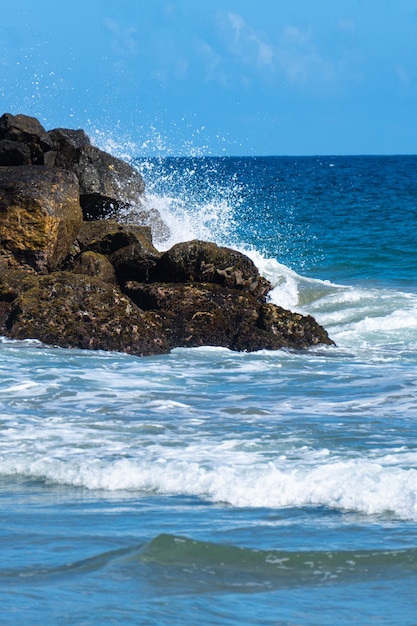 Waves crashing on the rocks at the beach